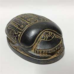 Ancient-style Egyptian scarab with engraved hieroglyphs, vintage collectible