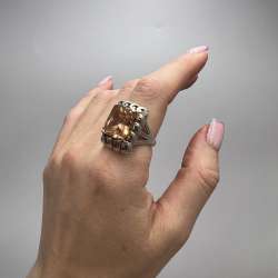Women's shiny 925 sterling silver ring set with an orange cubic zirconia stone
