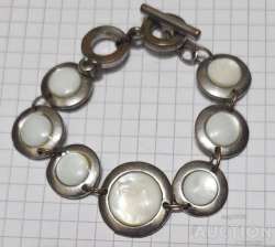 metal bracelet with white iserts