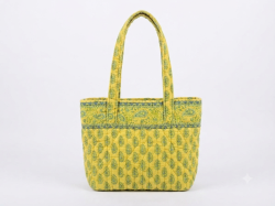 This is a Vera Bradley quilted tote bag featuring a vibrant yellow and green col
