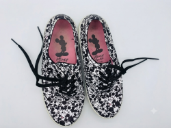 These are women's canvas sneakers featuring an all-over Mickey Mouse print