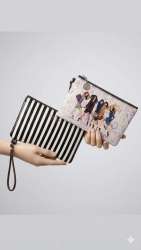 These images showcase Kate Spade New York wristlet pouches, featuring two distin