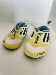 Adidas F50 Adizero toddler football boots featuring a distinct yellow, white
