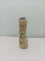 Hand-carved resin candlestick An old letter engraved with a musical instrument