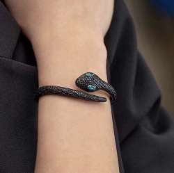 A stylish and sophisticated bracelet featuring a sleek, sneaker-inspired design.