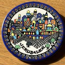 Traditional Jerusalem circle ceramic souvenir dish with the stylized colors