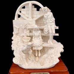 A valuable masterpiece of porcelain and gypsum. Two men and a woman on the river