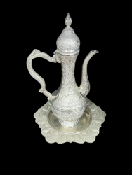 Antique white copper pitcher and tray with luxurious engravings and artistic dec