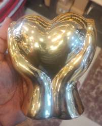 Elegant golden ceramic heart-shaped sculpture, perfect as a home décor or gift