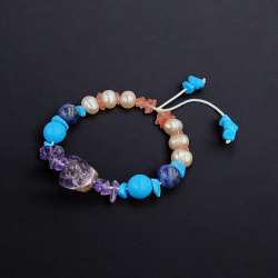 Pisces bracelet made of precious stones: pearls amethyst turquoise lapis lazuli