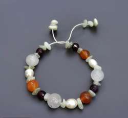 Virgo bracelet made of precious stones such as red garnet pearls onyx