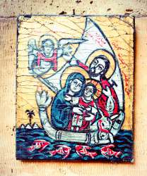 Ancient artifacts & an icon of the Holy Family on a boat in Egypt.