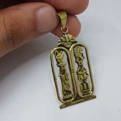 Elegant gold-tone copper cartouche pendant with pharaonic Egyptian design