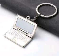 Metal laptop-shaped keychain, stylish accessory for bags and a perfect gift.