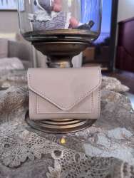 Small wallet made of genuine beige leather, lightweight, pre-owned, with organiz