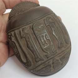 Hand-carved Egyptian scarab featuring hieroglyphs, authentic ancient style