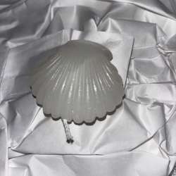 Add a touch of elegance and tranquility to your home with this seashell-shaped