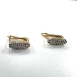Elegant 14K yellow gold plug earrings with delicate design and sparkling zircon