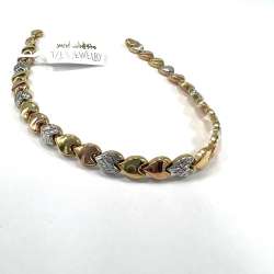 14K gold bracelet in yellow white & rose tones featuring a delicate heart design