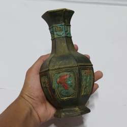 Ancient Egyptian-style vase with intricate hieroglyphic and painted designs