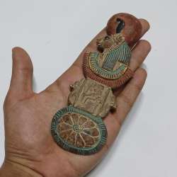 Handcrafted Egyptian figure with intricate patterns and a classic ancient design