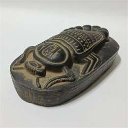 Ancient Egyptian scarab artifact style handmade stone carving with hieroglyphs