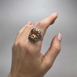 Women's shiny 925 sterling silver ring set with an orange cubic zirconia stone