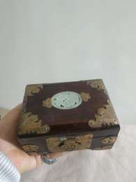 Antiques in the form of a jewelry box made of wood crowned with copper in variou
