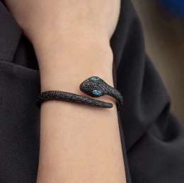A stylish and sophisticated bracelet featuring a sleek, sneaker-inspired design.