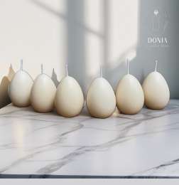 Six egg-shaped candles