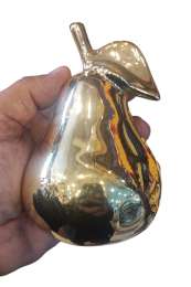 Shiny gold ceramic pear figurine, beautifully reflects light, perfect for luxury