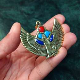 An antique Egyptian pharaonic piece, hand-crafted and inlaid with unique stones.