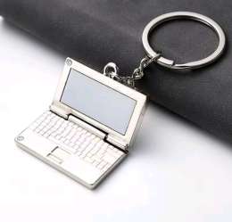 Metal laptop-shaped keychain, stylish accessory for bags and a perfect gift.