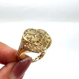 Heart-shaped 14K yellow gold ring with delicate zircon accents, unique design.