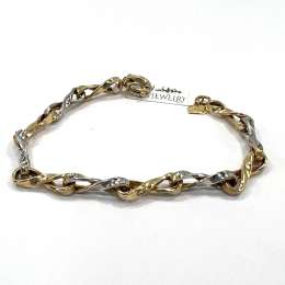 14K yellow and white gold bracelet with a beautiful infinity-inspired design.