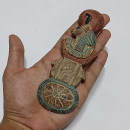 Handcrafted Egyptian figure with intricate patterns and a classic ancient design