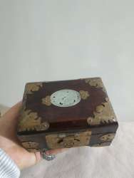 Antiques in the form of a jewelry box made of wood crowned with copper in variou