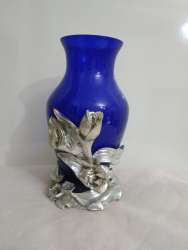 Vintage blue crystal vase on a hand-carved base with chrysanthemum flowers