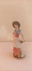 vintage Porcelain figurine of a woman sitting on a tree, made in Japan, hand-car