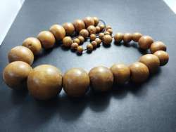An antique women's necklace made of wood, rare and beautiful pieces